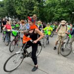 IMG-20230618-WA0099 Rowerzyści jadący asfaltowa drogą