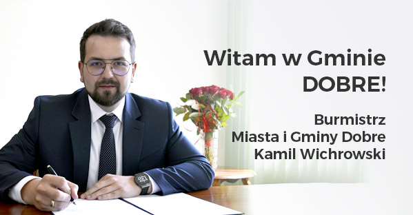Na obrazku mężczyzn w garniturze, siedzącego przy biurku i podpisującego dokument. Zasłania go napis "Witam w Gminie Dobre! Burmistrz Miasta i Dobrej Gminy Kamil Wichrowski", odprowadzacy, że jest to portret burmistrza tej miejscowości.