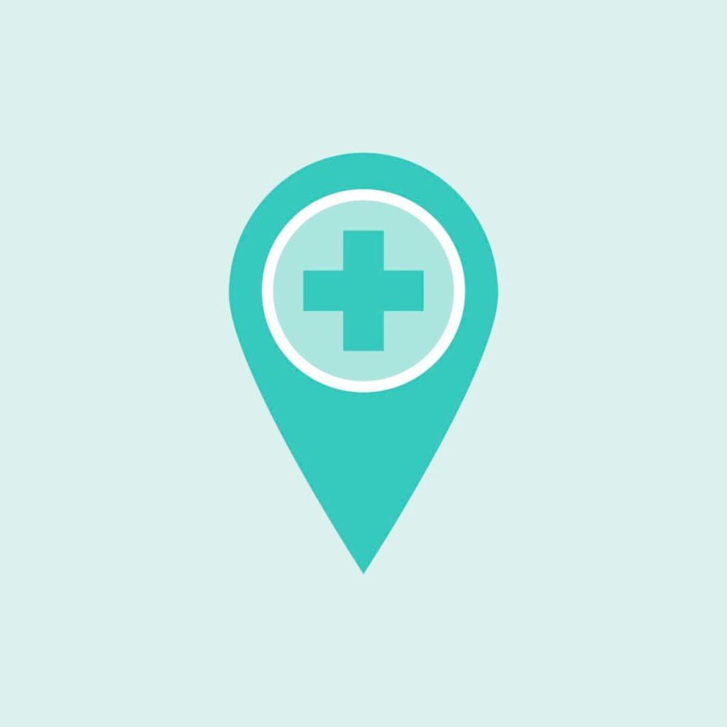 Na obrazku jest jasnoniebieska ikona pinzki do map z białym krzyżem medycznym w środku. Tło obraz jest utrzymane w prostym, aqua kolor.